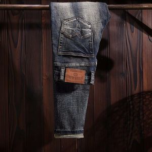 Erkek kot moda tasarımcısı erkekler retro koyu mavi elastik ince yırtık pantolonlar vintage nakış streç denim pantolon hombre