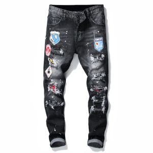 Calça masculina Badge Rips Stretch Black Jeans Moda masculina Slim Fit Washed Motocycle Jeans Paneled Hip HOP Calças CXG2308062