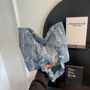 Totes kvinnors väska 2023 Ny bläck blå tygväska kvinnors fritidspåse stor kapacitet denim veckade en axel handhållen bagstylishhandbagsstore