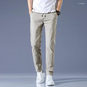 Мужские брюки 2023 Лето тонкие повседневные мужчины Эластичная спортивная корейская версия молодежи Fit Fashion Streetwear