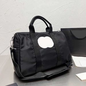 CC Duffel Torbalar X Mektup Tasarımcı Bagaj Koruma Kadın Tasarımcı Çanta Naylon Lüksler Çanta Seyahat Tasarımcıları Çapraz Vücut Çanta Moda Çift Mektuplu Çanta Cüzdan