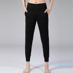 Calças de ioga esportivas com sensação de nudez leggings de ginástica elásticas com dois bolsos laterais 321