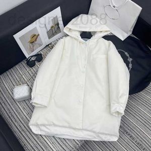 Women's Down Parkas Designer 23 Wiek celebrytów Nowy Temperament Zmniejszenie wszechstronnego koloru stałego odwróconego trójkąta dekoracji z kapturem płaszcz z kapturem dla kobiet suwt