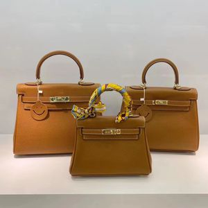 Ny lyxdesigner Cowhide Epsom läder axel crossbody väskor mode tryckt brev tygväska damer mångsidiga kvinnor 20 25 28 cm handväskor