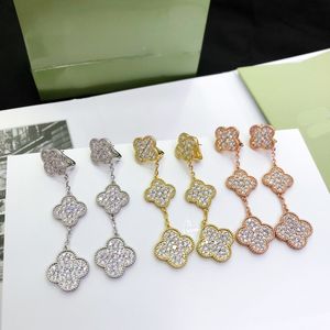 Designer high-quality luxury women's full diamond four-leaf flower solid color stud earrings ear clip