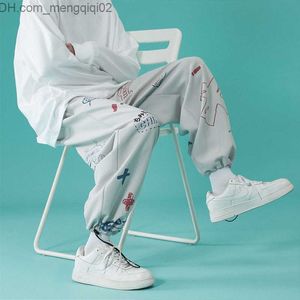 Herrenhosen Eis Silk Jogger Hosen Hip Hop Hosen Herrenmodaturmarke Männer lose Jogginghosen Sommer dünne Freizeithosen 9 Punkte Z230814