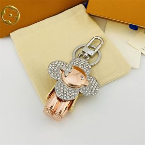 Designer Keychain Luxury Women Keyring High Quality Car Keyring Gold Black Metal Small Jewelry Charm Pag hängsmycken bra gåva