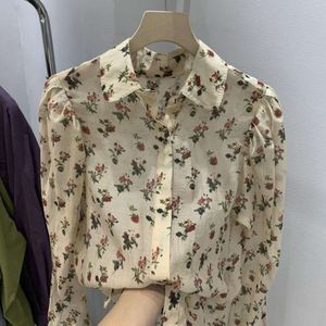 Camicia a maniche lunghe floreali francese per donne in stile primaverile rivelando leggermente sciolte e uniche