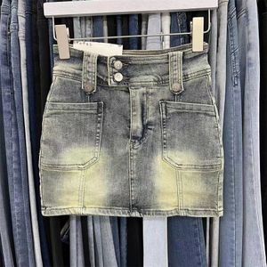 Kjolar y2k vintage kvinnor koreansk knapp bälte korta denim mini kjolar estetiska fairy grunge hög midja jeans a-line kjol alt kläder 230811