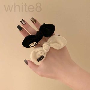 Hair Rubber Bands designer The new Korean version is stylish and stylish, with a black velvet bow rabbit ears. It has gold label hair circle foreign style tie rope YX4J