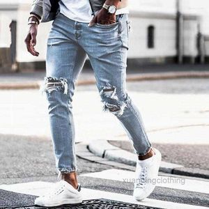 Os jeans masculinos rasgaram calças européias de jeans americano arruinaram Rasz