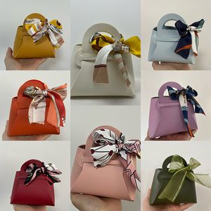 Bolsas de presente de couro fita de fita de arco bolsa de casamento saco de favor distribuições caixa de embalagens de doces de natal mini bolsa