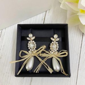 Dingle örhängen Europe America Bow Crystal Pearl Flower 925 Silver Needle Women Luxury Jewelry Top Quality Designer Boutique Fine Gift