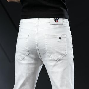 Gli uomini allungano jeans magri alla moda casual slim fit smenim pantaloni bianchi pantaloni maschi di abbigliamento del marchio affari