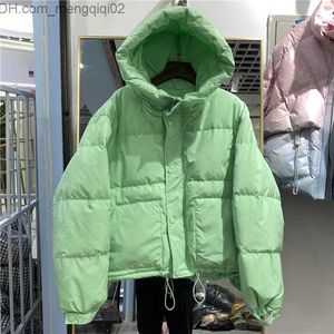 Women's Down Parkas Women's new winter hooded leather jacket with white duck down jacket suitable for women's fashionable long sleeved candy jacket Z230818