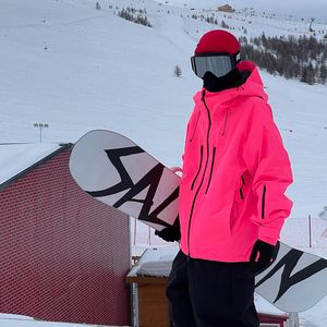 Damenjacken Unisex fluoreszierende rosa Skijacke für Männer Frauen winddichte Overalls Hoodie wasserdichte Outdoor-Snowboard-Sportbekleidung 230816