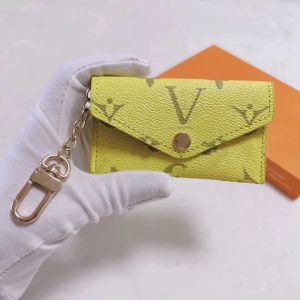 2024 Ny lyxdesigner Keychain Fashion Womens Mini Plånbok Högkvalitativ äkta läder Män mynt Purse Color Wallet Holder Love