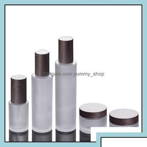 Packing Bottles Wholesale Frosted Glass Cosmetic Jars Pump With Plastic Woodgrain Cap 30G 50G 30Ml 100Ml 120Ml Body Lotion Lip Balm Otwoq