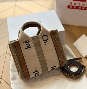 Modedesigner väska tote väska designer väska crossbody väskor pursar lyxiga handväskor shoppingväskor duk material väver hobo axelväska20*16 cm