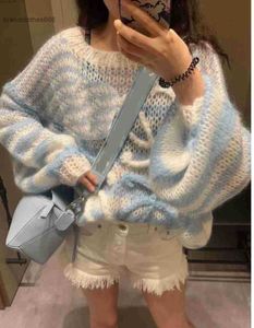 2023 Autumn and Winter New Advanced Sense Casual Age Reducing Soft and Soft Glutinous Blue White Hollow Pullover Knitted Sweater for Women