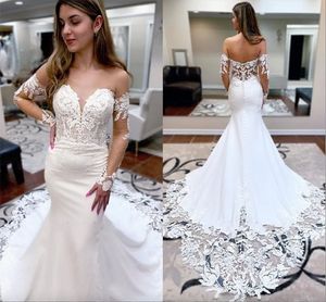 Splendidi abiti da sposa sirena in pizzo sexy Appliques a velo a velo a manica lunga abiti da sposa con bottoni coperti