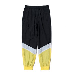 Calça masculina pacote de veterano poliéster amarelo em emenda branca em emenda preta elástica elástica tata de alta qualidade homens homens calças 230822