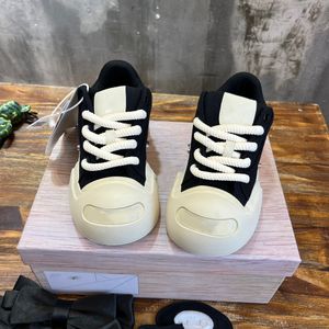 Designers create young trendy and unique beauty for men and womenSuper cute ugly and bloated canvas shoes with a big open mouth and a smile