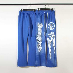Pannelli casual pantaloni streetwear pantaloni da jogger per pantaloni della tuta Hellstar Studios Stampa di fango blu usurati pantaloni casual pantaloni a campana a campane