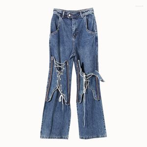 Jeans femminile pantaloni in alto in giro in denim flare patchwork Lace-up da donna jean con zip croce bandage tasche streetwear versatile versatile lungo