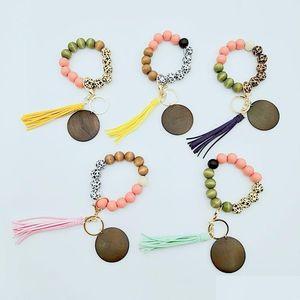 Keychains Lanyards 10 Styles Träarmband Keychain med tofs -nycklar Diy Wood Fiber Pandent Woodwooden Bead Bangle Key Dekorera otftb