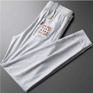 European Station Light Luxury Summer Thin Ice Silk Twill White Sports Pants Men's Loose Press Lim Bubble Letter Casual Pantsa6F6