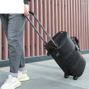 Duffel Bags Cowhide Big Handbag With Wheel Carry-On Bag äkta läder Travelbagage Wheeled Duffle Trolley Rolling resväska Kvinnor Män