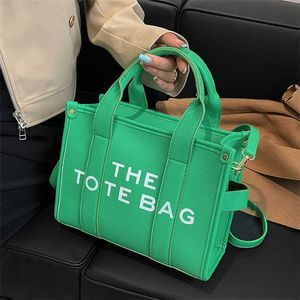 Bolsas liberação 70% de desconto nova versão simples e elegante estilo diagonal straddle carta impressa grande bolsa de ombro único feminina