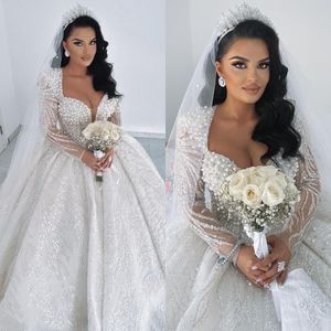 Luxury Crystal Ball Gown Wedding Dresses Illusion Long Sleeves Beads Pearls Wedding Dress Sweep Train bridal gowns