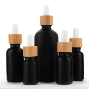 Garrafas de óleo essencial de vidro preto fosco, frasco conta-gotas de soro para cuidados com a pele com pipeta de bambu 10ml 15ml 20ml 30ml 50ml 100ml