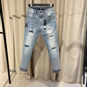 Designer Luxury Summer Fall Fashion High Street byxor tvättar jeans andningsbara elastiska mönstrade denimbyxor för män och kvinnor