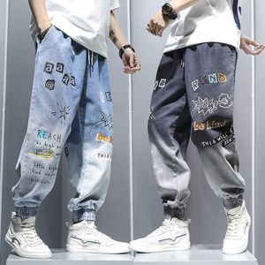 Jeans masculino graffiti impressão jeans gradiente masculino calças de hip hop harém desenho animado solto no tornozelo casual calça de calça jeans para homens z0301