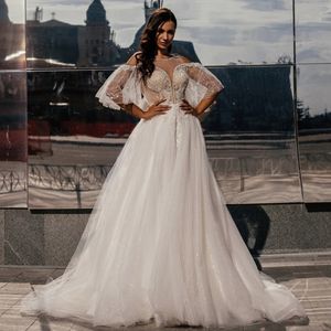 Afrykańskie Dubaj Eleganckie sukienki ślubne A Sheer szyi koronkowe aplikacje Kequine Sweep Train Wedding Suknie ślubne