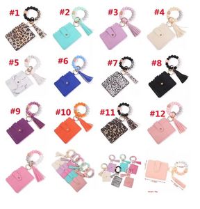 DHL Fashion Pu Leather Armband Wallet Keychain Party Favor Tassels Bangle Key Ring Holder Card Bag Silicone Pärled Wristlet Keychains Handbag E0308