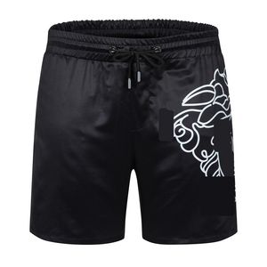 Shorts masculinos Calças de praia masculinas de tecido impermeável de designer de moda Shorts masculinos de verão roupas de marca roupas de banho calças de praia de náilon calções de banho M-3XL