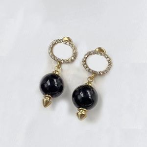 Black pearl drop charm earrings. Luxurious earrings with rhinestone logo. Fashion ladies brand designer earrings. Glamorous wedding party aretes designer jewelry