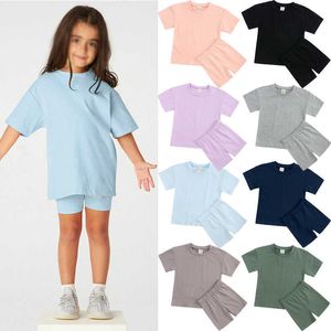 Flickor kläder set casual sports kostym 2023 Spring and Summer Korean version Girls 'Short-Sleeve T-shirt Shorts Two Piece Set
