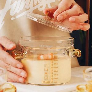 Суп бульон горшок с боросиликатным стеклянным приготовлением прозрачная миска с тушеной тушеной чашкой на пареный заварной крем для яиц.