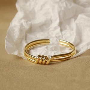 Bracciale rigido europeo e americano minimalista annodato a spirale design creativo moda ottone galvanica gioielli coppia regalo braccialetto
