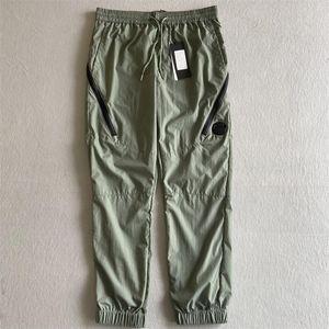 Tasarımcı Mens Pant Pantolon Kargo Cep Lens Naylon Swearpant Jogging Pantolon Açık su geçirmez eşofman gevşek adam hızlı kuru pantolon