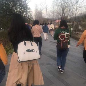 تخزين رخيص 90 ٪ من حقائب المرأة بالجملة Xiaonanxi Sac Femme Handheld Canvas حقيبة الكتف Bolso Cowhide التسوق السعة كبيرة الأم