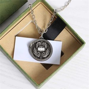 2023 Designer New jewelry double spirit snake circling wings round plate carved pattern pendant Street hip hop Style Necklace