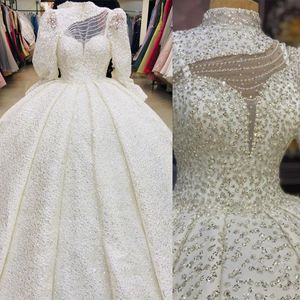 Lyx bollklänning bröllopsklänningar hög nackkonst design ihåliga långa ärmar som lyser sökande backless blixtlås golvlängd skräddarsydd brudklänning vestidos de novia