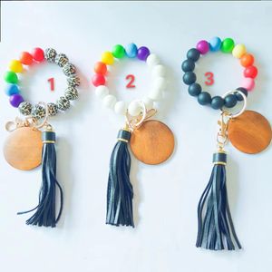 Portachiavi con braccialetto di perline per il commercio estero portachiavi personalizzato con nappa in pelle PU con braccialetto arcobaleno in silicone creativo