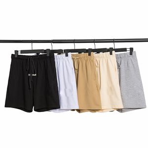 Pantaloncini di vendita calda Pantaloni da jogging estivi da uomo Abbigliamento da spiaggia Pantaloncini sportivi rilassati Palestre Allenamento Pantaloni corti maschili taglia s-xl Stile europeo e americano nero bianco